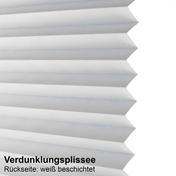 Anthrazitfarbenes Verdunklungplissee mit strukturiertem Faltendesign liegt flach auf einer weißen Oberfläche. Das Material wirkt lichtdicht und eignet sich für individuelle Fensterdekoration.