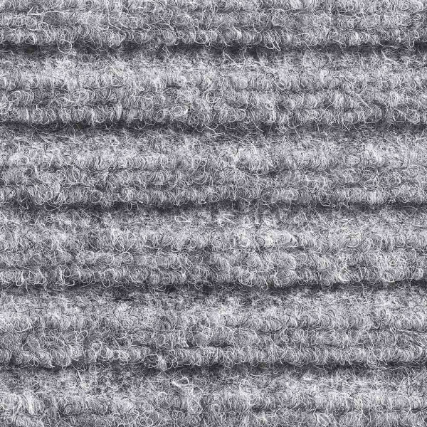 Graue Nadelfilzmatte Montana mit einer strukturierten Oberfläche, die aus mehreren übereinanderliegenden Lagen besteht. Die Matte eignet sich als robuste Fußmatte für den Innenbereich.