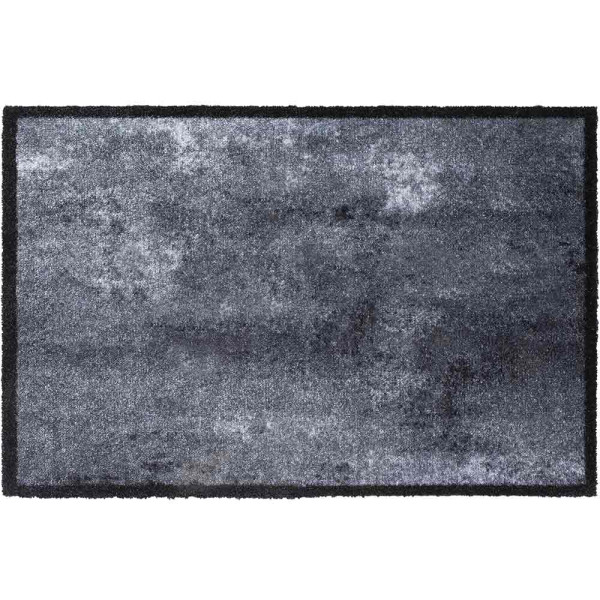 Graue Fußmatte mit einem modernen, strukturierten Design und schwarzem Rand. Sie liegt flach auf einem Boden und zeigt verschiedene grau-schwarze Farbnuancen.